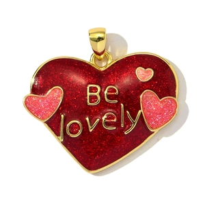 Macro detail of heart pendant with red glitter enamel and Be lovely inscription
