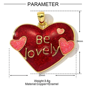 Detail of red enamel heart pendant with Be lovely gold lettering and copper clasp