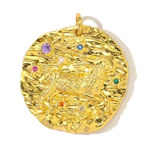 Detail of Aries zodiac pendant with colorful cubic zirconia and hammered gold texture
