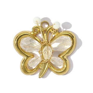 Detailed view of gold butterfly pendant with sparkling crystals and white beads