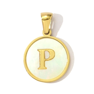 Detail of round shell letter P pendant in gold stainless steel with a white pearl base