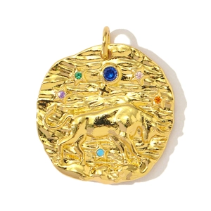 Detailed view of gold Taurus zodiac pendant with hammered texture and colorful gemstones