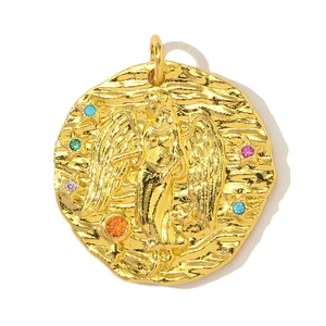 Detail of round gold-plated relief pendant with winged goddess and colorful zircons