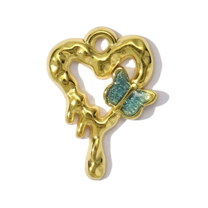 Detail of golden heart pendant with lava texture and a teal glitter butterfly design