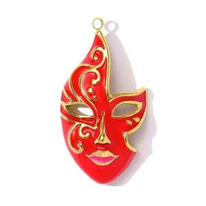 Macro view of Venetian theater face mask pendant in red enamel and gold accents