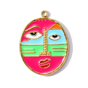 Detailed close-up of a colorful enamel face pendant with abstract artistic patterns