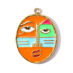 Close-up of abstract face enamel pendant in colorful artistic style for DIY jewelry