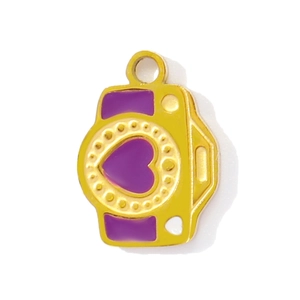 Detailed close-up of a gold-plated camera pendant with purple enamel and a heart pattern