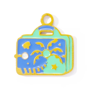 Travel suitcase pendant with tropical palm tree design in yellow gold and enamel finish