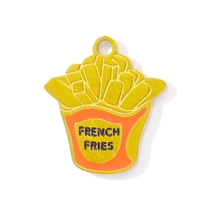 Macro shot of stainless steel French Fries pendant with yellow enamel and engraving