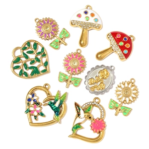 DIY colorful enamel and rhinestone charms featuring mushroom, sunflower and heart designs