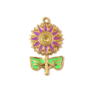 Detail of sunflower pendant with purple enamel petals and yellow crystal in gold setting