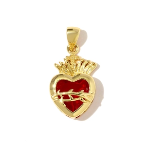 Golden Sacred Heart pendant with red core and crown of thorns detail on white background
