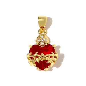 Detailed view of red heart crystal pendant with gold thorns and cross zircon detail
