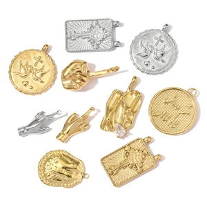 Assorted gold and silver stainless steel pendants with cross, dove and rose motifs