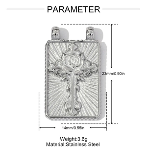 Macro view of stainless steel rectangular pendant with rose and cross relief engraving