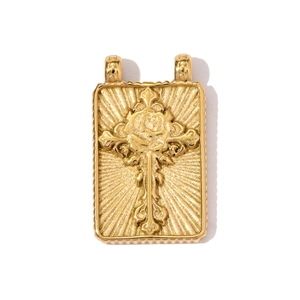 Detailed relief of gold cross with rose flower and sunburst texture on rectangular pendant