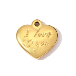 Detailed macro shot of a heart-shaped gold-plated pendant with I Love You engraving