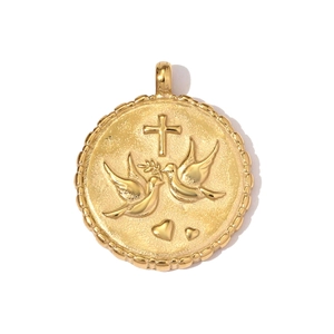 Detailed relief of golden cross and peace doves on vintage round stainless steel pendant