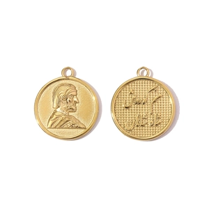 Detail of vintage gold coin pendants showing royal portrait and Arabic script engraving