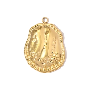 Detailed view of a gold-plated irregular bubble texture charm with beaded edge detail