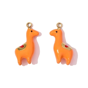 Detail of vibrant orange alpaca charms with colorful saddle for DIY jewelry making