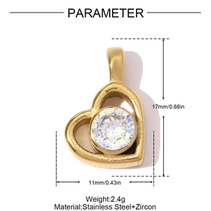 Macro detail of a 17mm gold stainless steel heart pendant featuring a sparkling zircon stone