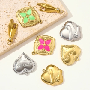 Variety of polished stainless steel heart and clover pendants in gold and silver finish