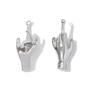 Detailed macro of silver polished stainless steel gesture pendants for DIY jewelry