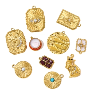 Assorted gold stainless steel charms featuring evil eye, star, cat and fish designs