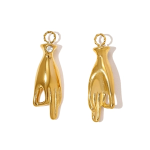 Close-up of gold-plated OK gesture charms with zircon inlay for necklaces and bracelets