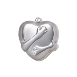 Detailed macro view of heart-shaped stainless steel pendant with hug relief design
