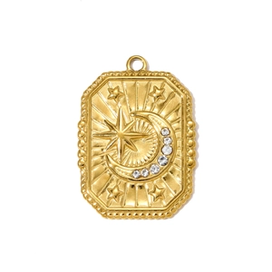 Detailed macro view of a gold rectangular pendant featuring embossed star and moon details