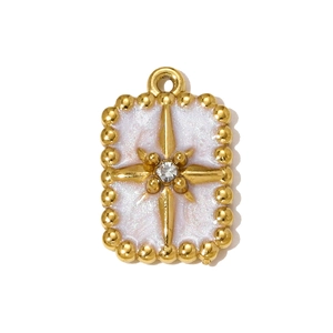 Close-up of a gold star compass pendant with lavender enamel and a central zircon