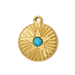 Detail of round gold starburst pendant featuring a vibrant turquoise stone inlay