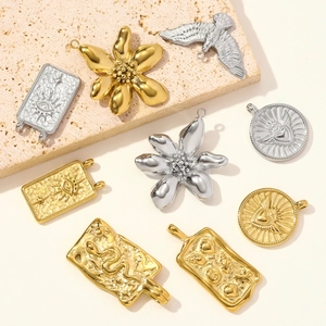 Collection of stainless steel pendants featuring evil eye, snake, and eagle motifs