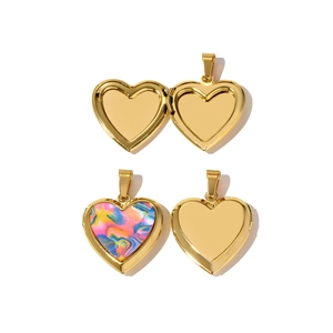 Detailed interior view of a gold heart locket showing the inner frame for personal photos