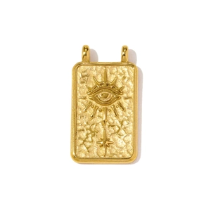 Macro shot of gold stainless steel rectangular evil eye pendant with hammered texture