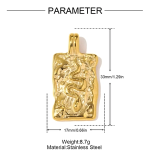 Detail view of gold stainless steel snake pendant with size dimensions 33mm by 17mm