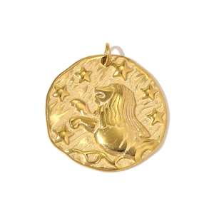 Detailed relief of Leo zodiac sign on a vintage gold-toned coin pendant with stars