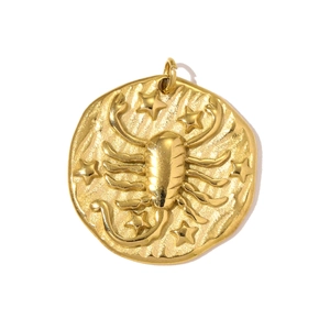 Detailed macro view of the gold Scorpio zodiac pendant with embossed scorpion design