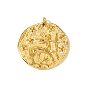 Macro shot of gold stainless steel Sagittarius zodiac pendant with embossed archer details