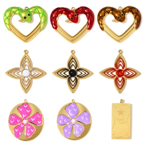 Nine stainless steel floral and snake heart pendants with colorful enamel finishes