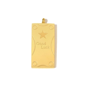 Detailed view of rectangular gold pendant engraved with Good Luck and a star motif