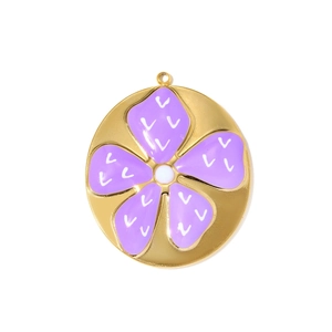 Detailed macro view of a golden stainless steel pendant with a purple enamel flower design