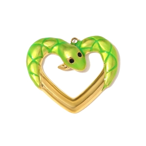 Detailed view of heart-shaped snake pendant with green enamel scales and gold plating