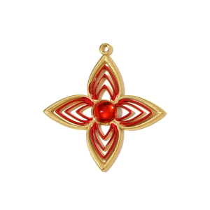 Detailed view of a gold stainless steel flower pendant with red enamel and central ruby stone