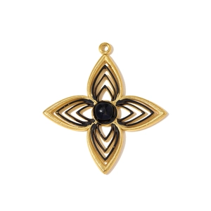 Detailed macro view of a golden four-leaf flower pendant with black enamel and rope edge