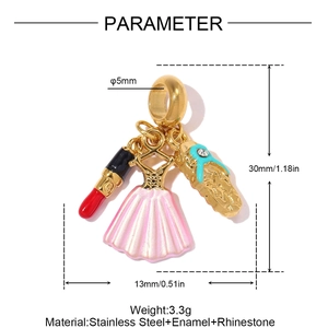 Macro view of stainless steel charms with enamel lipstick, dress, and rhinestone shoe
