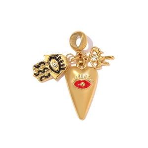 Detailed view of a golden Hamsa hand and evil eye heart pendant with red enamel